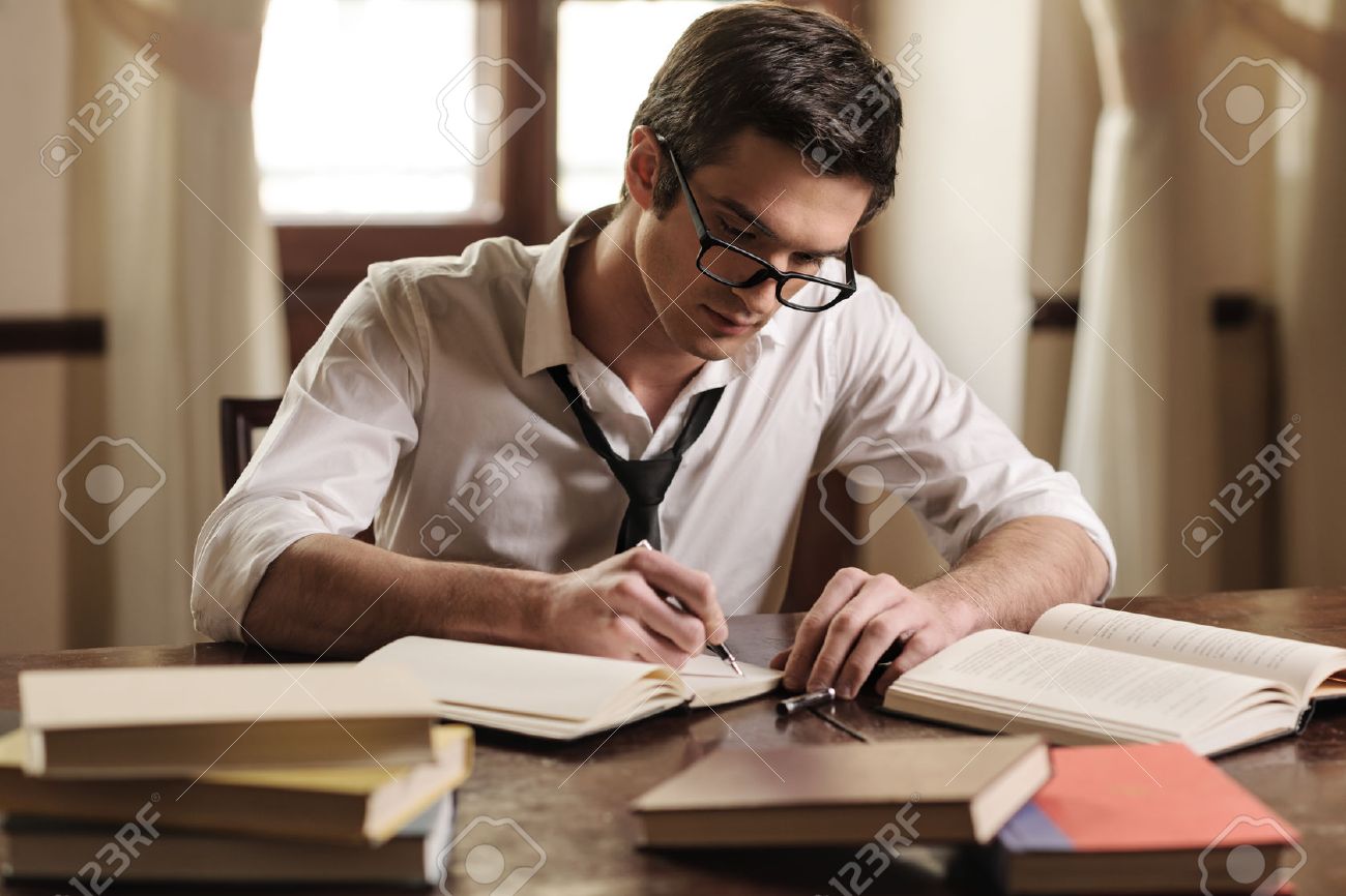 KIwvNsQxmNf_22853972-writer-at-work-handsome-young-writer-sitting-at-the-table-and-writing-something-in-his-sketchpad.jpg